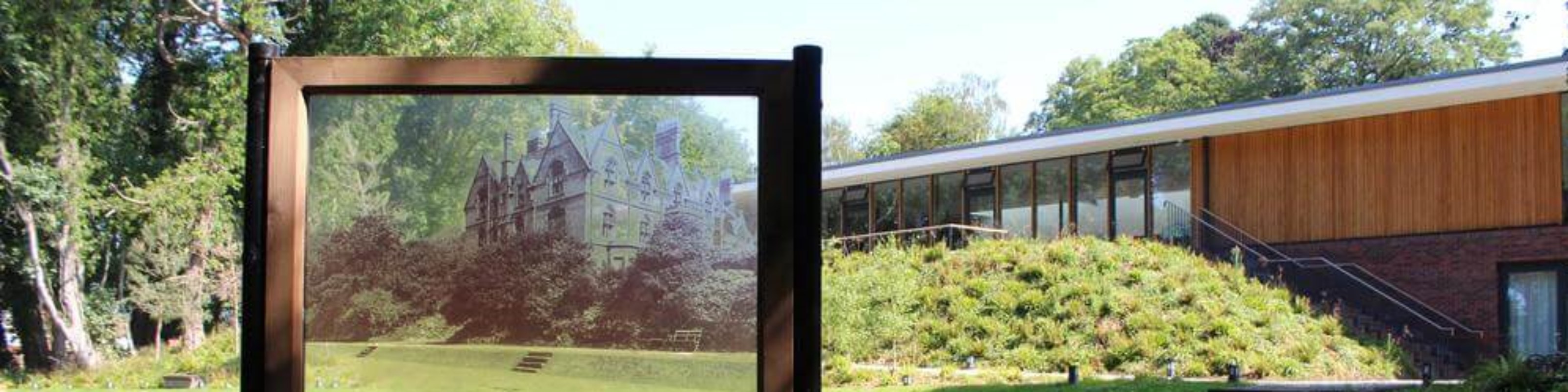 A image on the Strawberry Field garden, which a wooden frame with a window which shows where the old Victorian building once stood.